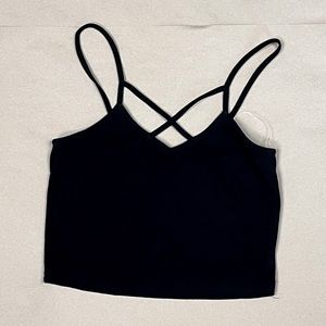 Black cross-cross crop top with spaghetti straps. Slightly stretchy.